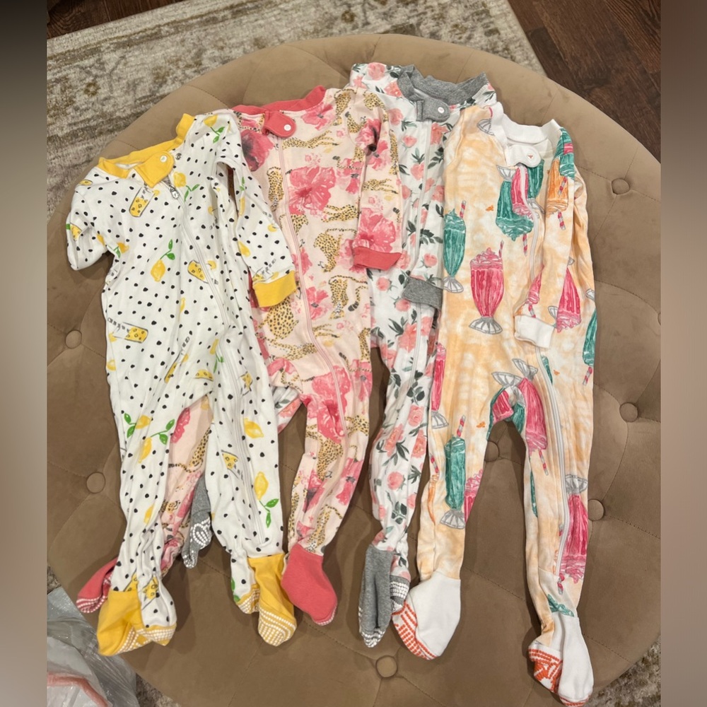 Burt’s bee footed pajamas. Girl themed 4 pack size 12mos.
